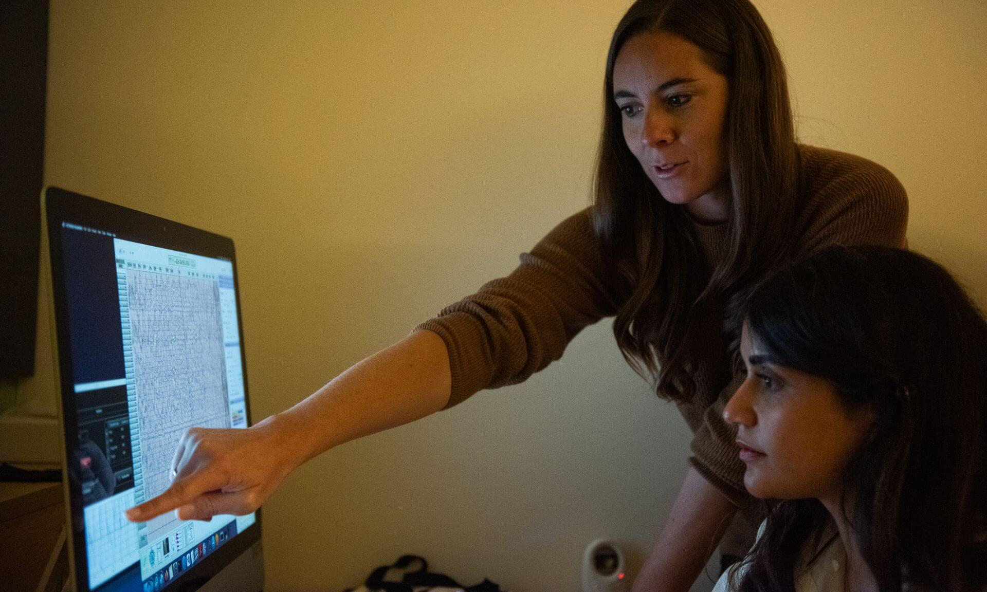 Catherine Duclos with Hanieh Bazregarzadeh, the designer of the auditory stimulation software that integrates directly with their high-density EEG system.