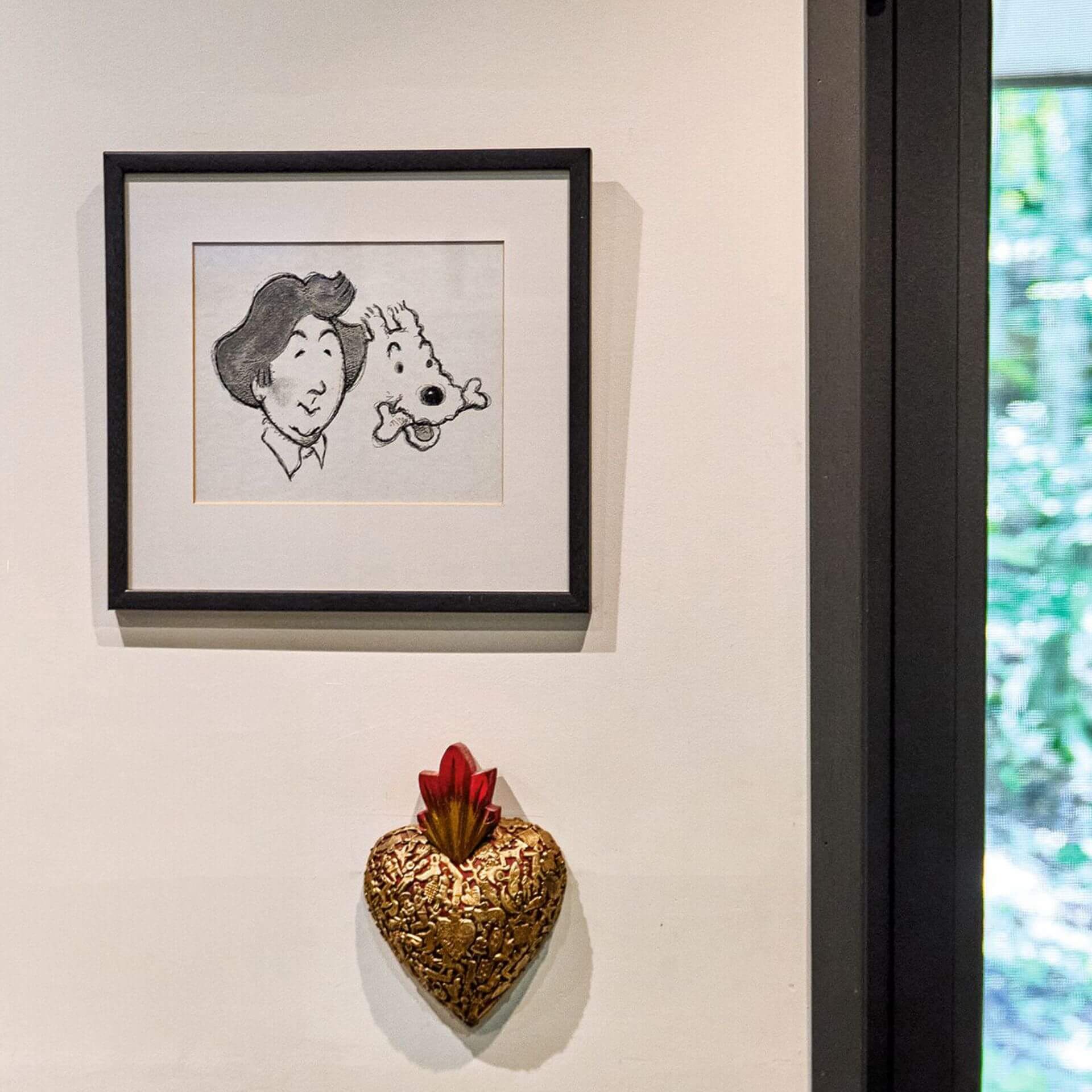 On one wall hangs a cartoon of Louise Arbour dressed as Tintin with Snowy, which appeared several years ago in the English-language Canadian press.